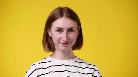 4k slow motion video of one girl posing for a video over yellow background. Stock Footage 228687527