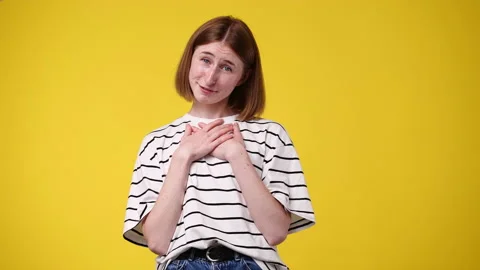 4k slow motion video of one girl feeling emotional on yellow background. Video stock 228687870