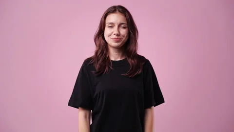 4k slow motion video of one girl posing for a video over pink background. Stock Footage 228717612