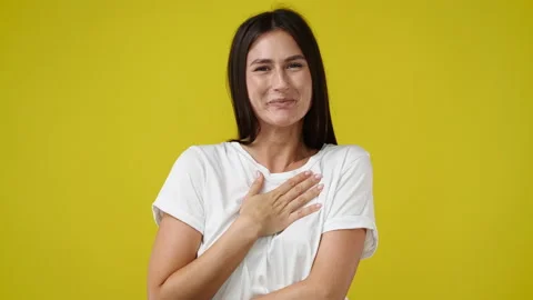 4k slow motion video of one girl posing for a video over yellow background. Stock Footage 229293073