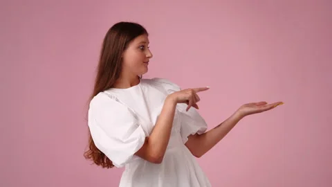 4k slow motion video of one girl pointing at right and showing thumb up over Stock Footage 229307243