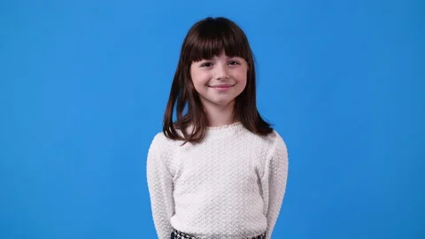 4k slow motion video of one girl posing for a video over blue background. Stock Footage 229701581