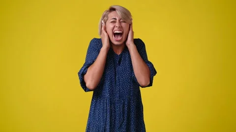 4k slow motion video of one woman closing her ears with hands. Stock Footage 229758417