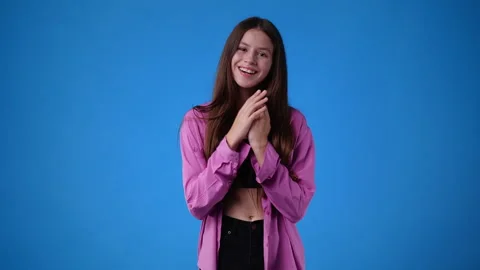 4k slow motion video of one girl gesturing no over blue background. Stock Footage 230001262