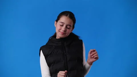 4k slow motion video of one girl dancing over blue background. Stock Footage 230007957