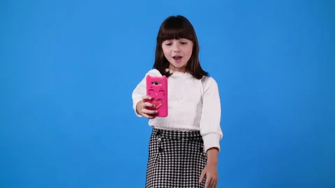 4k slow motion video of one girl having a videocall on blue background. Stock Footage 230177005