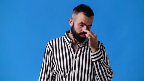 4k slow motion video of one man posing for a video over blue background. Video stock 230660271