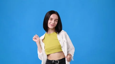 4k slow motion video of one girl dancing over blue background. Stock Footage 230924667