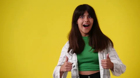 4k slow motion video of one girl feeling excited and showing thumbs up over Video stock 231142825
