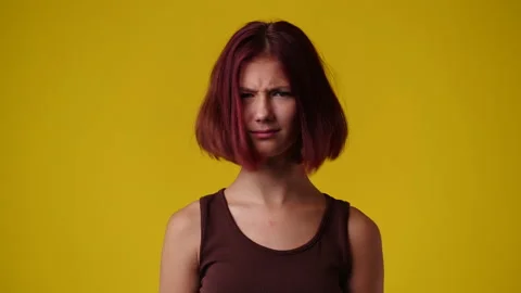4k slow motion video of one girl gesturing no over yellow background. Stock Footage 231148081
