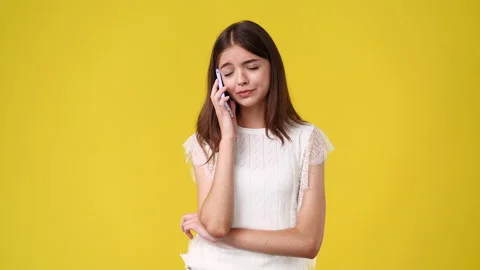 4k slow motion video of one girl having a talk over the phone. Video stock 231233889