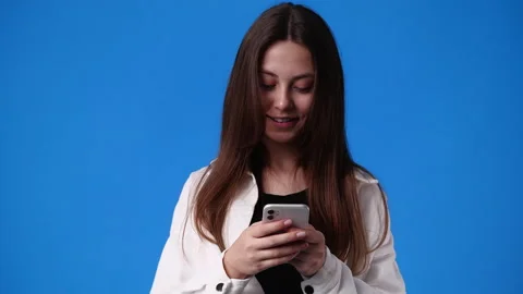 4k slow motion video of one girl sending message with positive facial expression Video stock 231334354