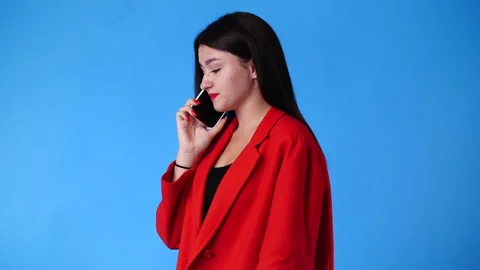 4k slow motion video of one woman having a talk over the phone. Stock Footage 231341238
