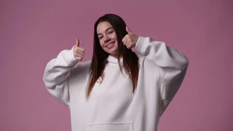 4k slow motion video of one girl pointing at camera and showing thumbs up over Stock Footage 231344225