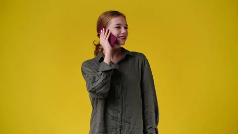4k slow motion video of one girl having a talk over the phone. Stock Footage 232783232
