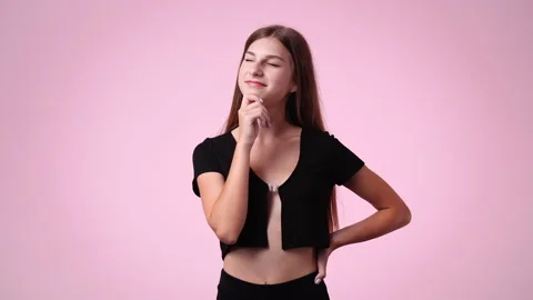 4k slow motion video of one girl who holding on to his chin and thinks about Stock Footage 233118525