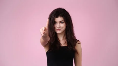 4k slow motion video of one girl who responds negatively to something over pink Video stock 233118758