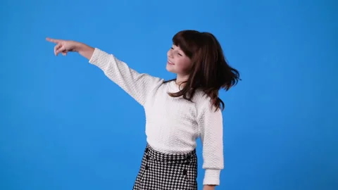 4k slow motion video of one young girl who calling someone and pointing to the Stock Footage 233736611