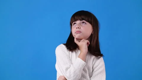 4k slow motion video of one young girl who thinking about something, then points Video stock 234627601