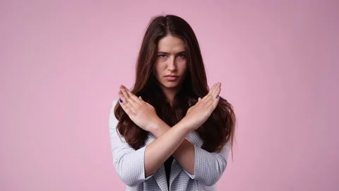 4k slow motion video of one girl who crosses her arms and responds negatively to Stock Footage 236638160
