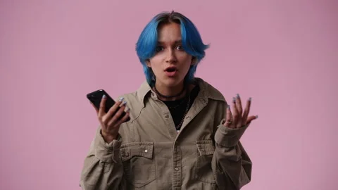 4k slow motion video of one girl who surprised by the message from the phone Video stock 241424886