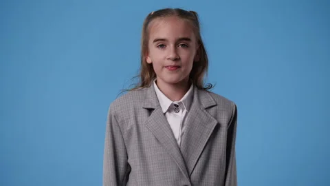 4k slow motion video of one girl who posing over blue background. Stock Footage 243318261