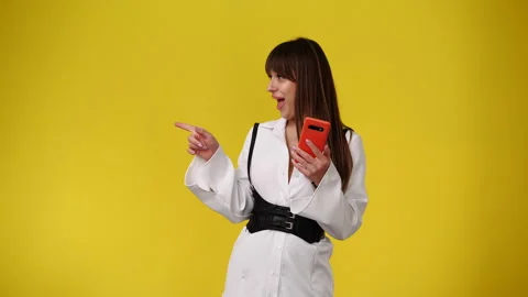 4k slow motion video of one woman who typing text on the phone and pointing to Stock Footage 243373971