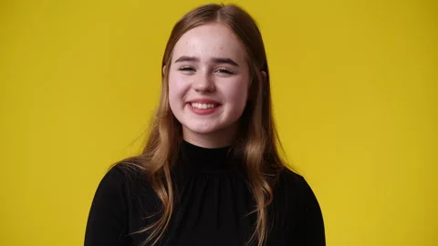4k slow motion video of one girl who agrees with something over yellow Video stock 244307265