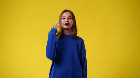 4k slow motion video of one girl who counts to three and then emotionally Video stock 244480815