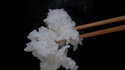 4K slow motion video of picking up rice with chopsticks. Video stock 282146506