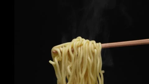 4K slow motion video of pulling up noodles with chopsticks. Stock Footage 282641123
