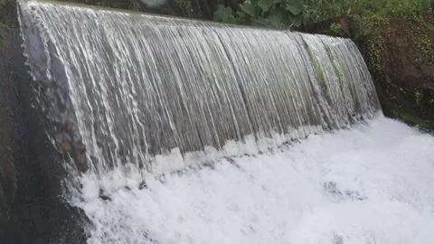 A 4K Slow Motion video of a tranquil cascading water fall and a flowing river Stock Footage 278806879