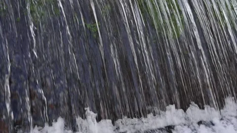 A 4K Slow Motion video of a tranquil cascading water fall and a flowing river Stock Footage 278807111