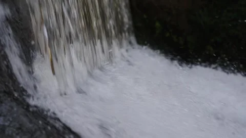 A 4K Slow Motion video of a tranquil cascading water fall and a flowing river Stock Footage 278807285