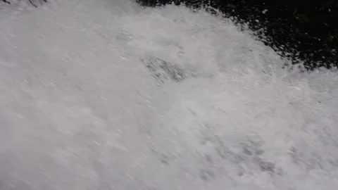 A 4K Slow Motion video of a tranquil cascading water fall and a flowing river Stock Footage 278807478