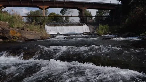 A 4K Slow Motion video of a tranquil cascading water fall and a flowing river Stock Footage 278807690
