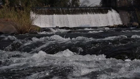A 4K Slow Motion video of a tranquil cascading water fall and a flowing river Stock Footage 278807691