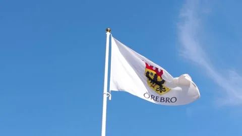 4k Slow-motion of a waving flag of Örebro city (Örebro Län ) in Sweden Stock Footage