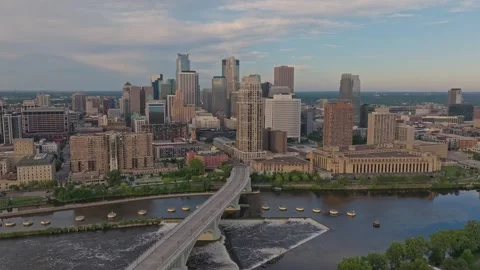 4K Slow Orbit Aerial View of Minneapolis Skyline Overlooking St. Anthony Falls Stock Footage 283339482