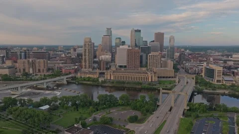 4K Slow Orbiting Aerial View of Minneapolis Skyline Overlooking Mississippi Stock Footage 283339420
