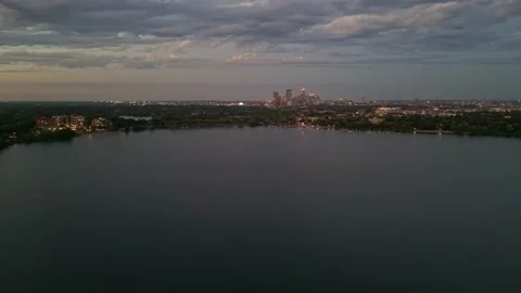 4K Slow Reverse Aerial View of Lake Calhoun And Minneapolis Skyline Stock Footage 220469827