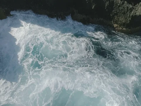 4k Slowmotion drone shot of powerful ocean waves crashing rocks in Tenerife Stock Footage 84048088
