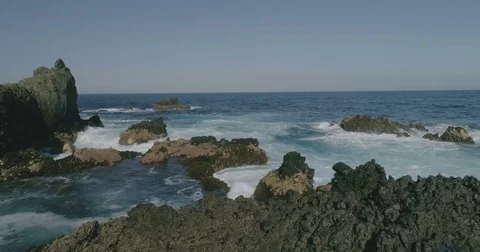 4k Slowmotion drone shot of powerful ocean waves crashing rocks in Tenerife Stock Footage 84076874