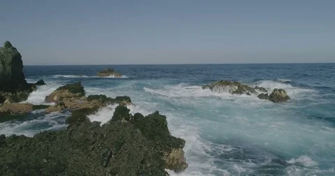 4k Slowmotion drone shot of powerful ocean waves crashing rocks in Tenerife Stock Footage 84077188