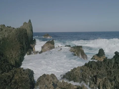4k Slowmotion drone shot of powerful ocean waves crashing rocks in Tenerife Video stock 84169930