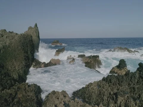 4k Slowmotion drone shot of powerful ocean waves crashing rocks in Tenerife Stock Footage 84170192
