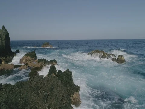 4k Slowmotion drone shot of powerful ocean waves crashing rocks in Tenerife Stock Footage 84170498