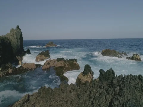 4k Slowmotion drone shot of powerful ocean waves crashing rocks in Tenerife Stock Footage 84170816