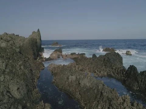 4k Slowmotion drone shot of powerful ocean waves crashing rocks in Tenerife Stock Footage 84171116