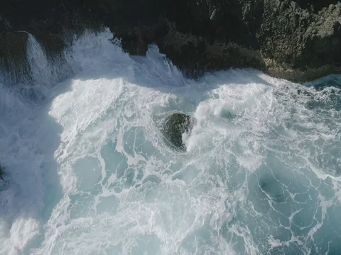 4k Slowmotion drone shot of powerful ocean waves crashing rocks in Tenerife Stock Footage 84190919